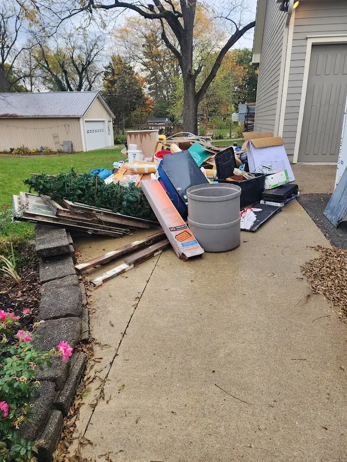 Dumpster being loaded with debris for 3 Yard Dumpster Rental in Scottdale